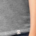 Ladies Heather Grey One shirt with woven label close up.